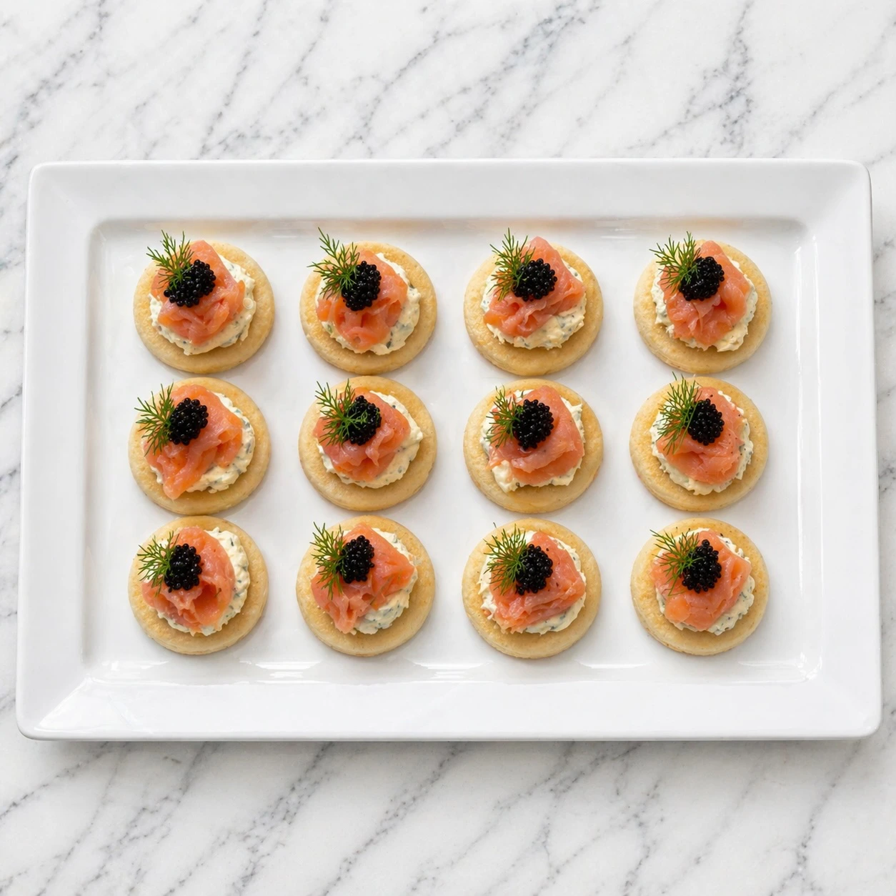 Canapes arranged on a white presentation tray