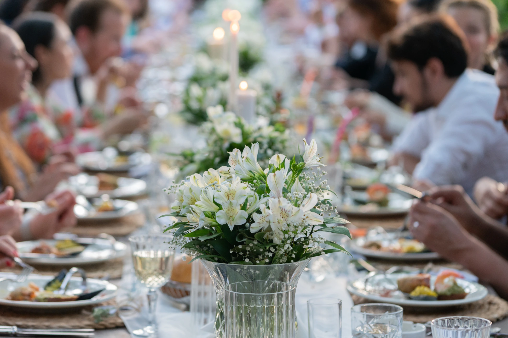 Private catered dining table with floral arrangements